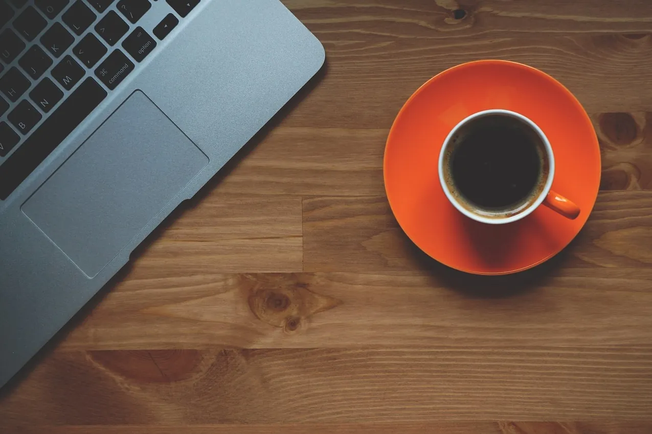 Cup of coffee, laptop, office