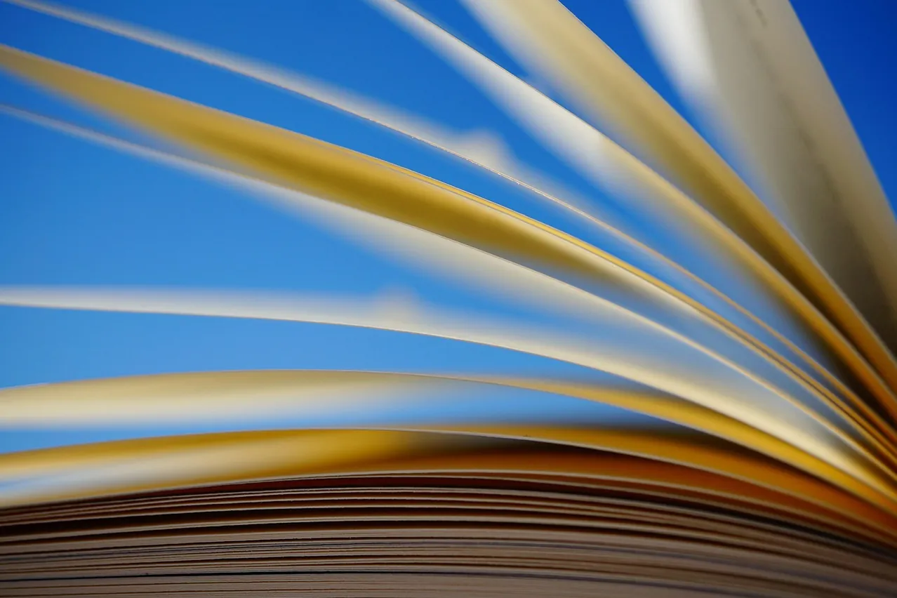 A book, pages, scroll