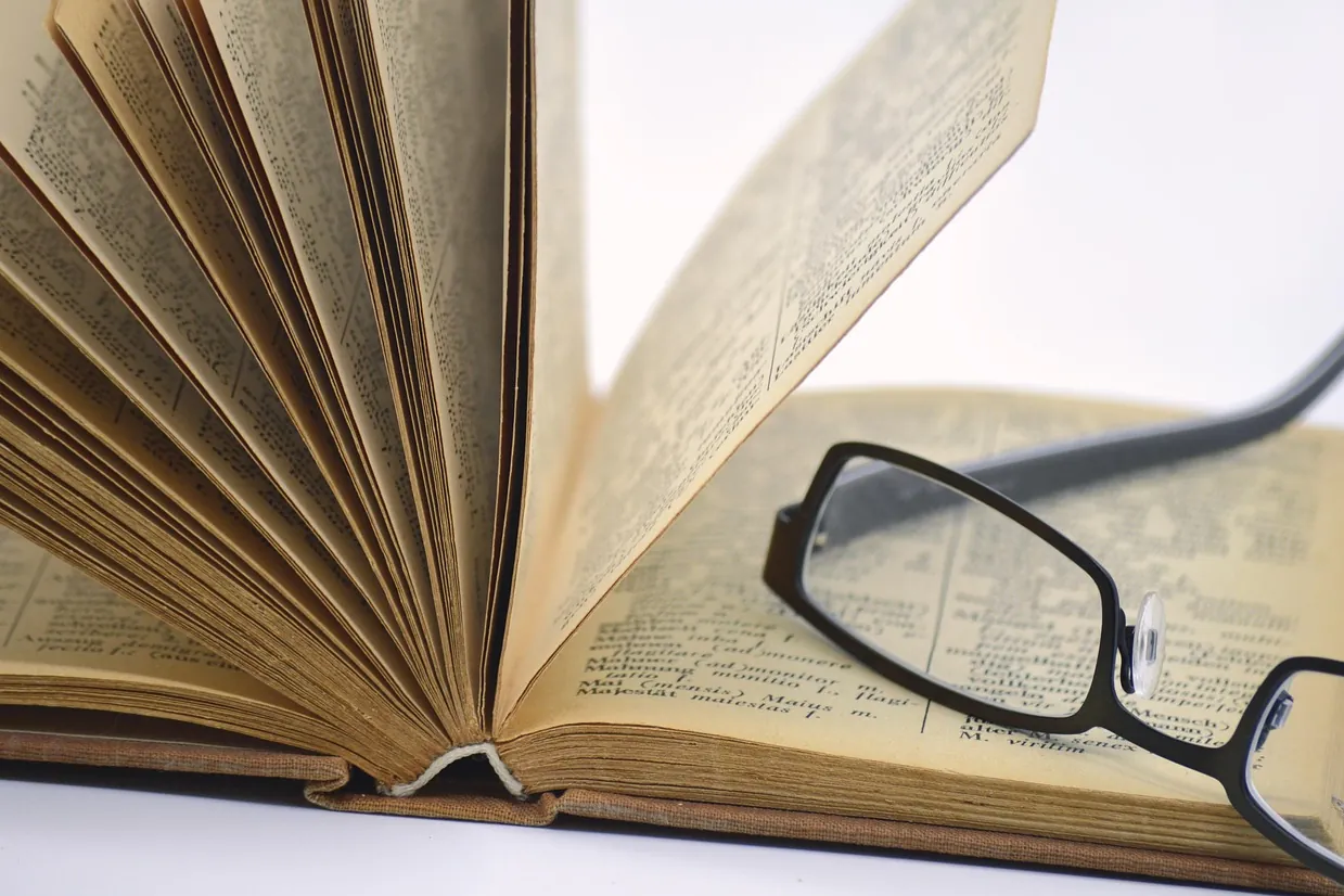 Old book, glasses, reading